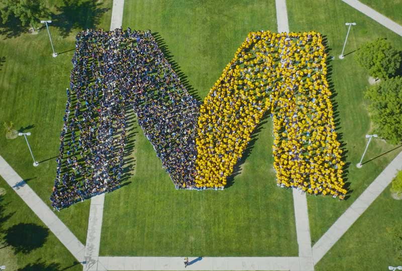 Young black man wearing a Black Student Union shirt at UC Merced